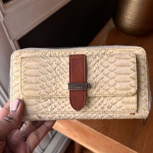 Crocodile wallet by Lodi’s.  Genuine.  Lots of compartments. Can be a clutch.